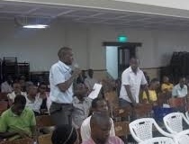 A participant asking a question during the public lecture